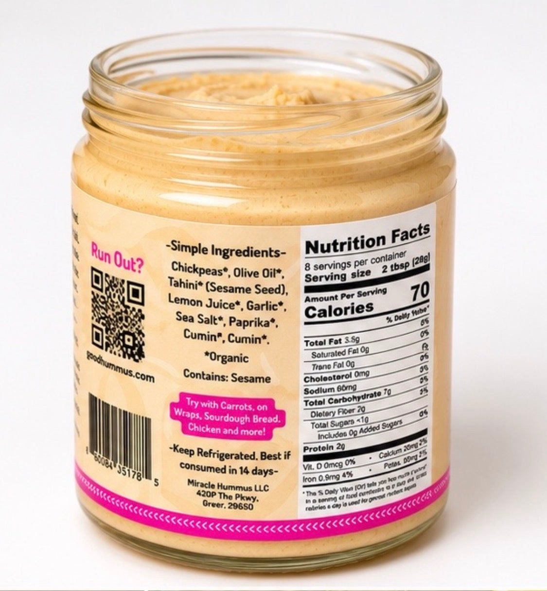 Jar of hummus with nutrition label on a white background